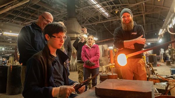 Charlie Gaull works with glassmakers to create his design in glass.